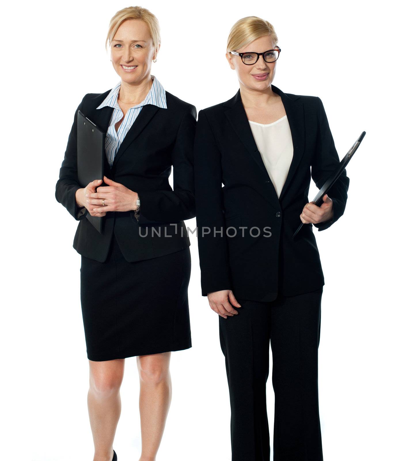 Two businesswoman holding documents over white background