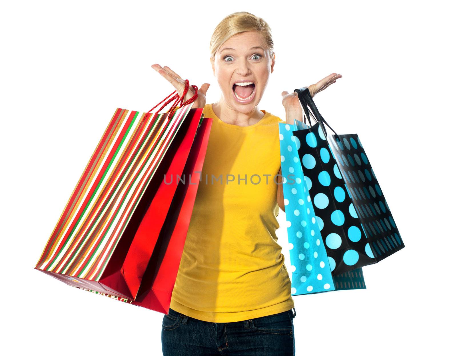 Young woman excited after tons of shopping. Expressing herself