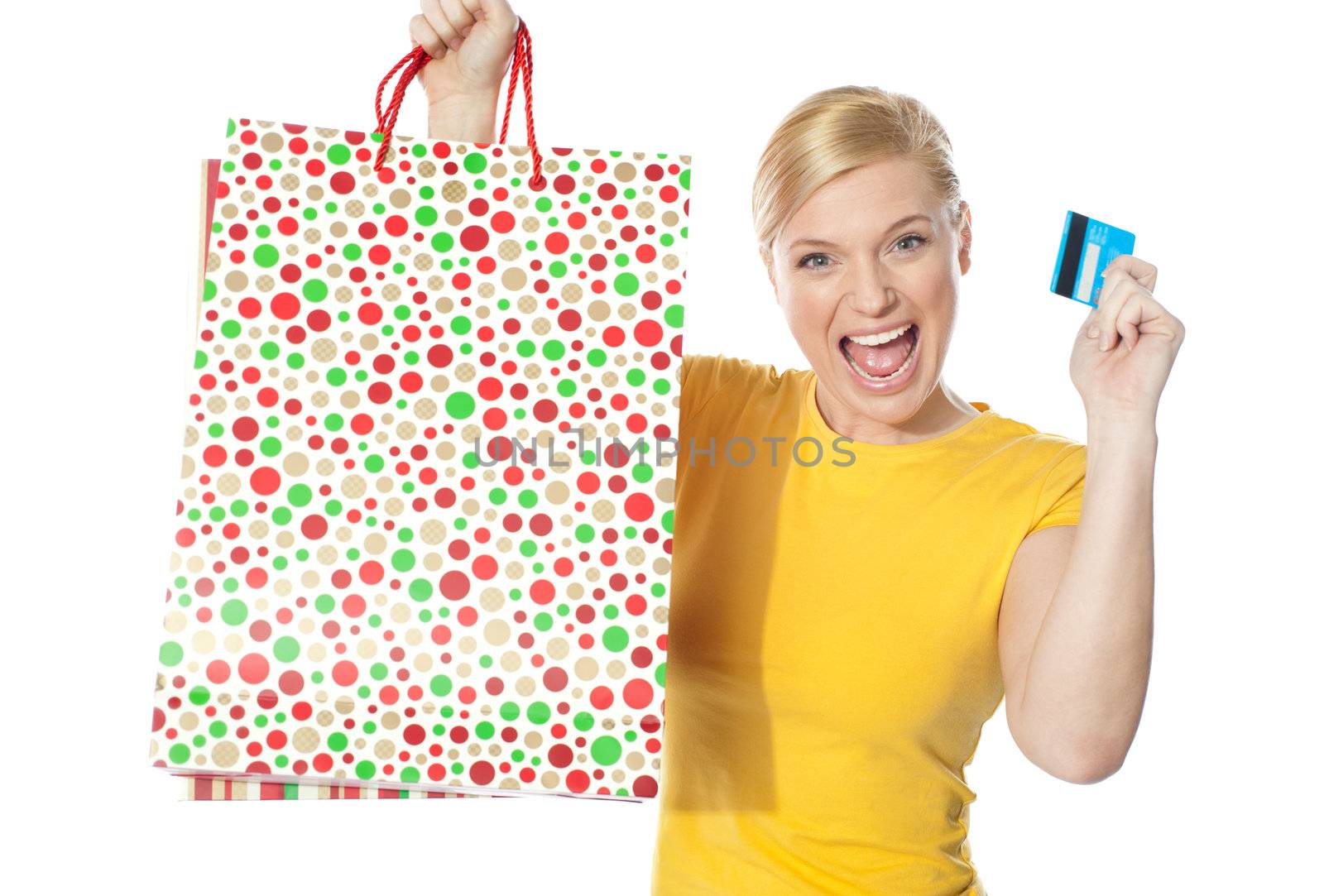 Beautiful girl posing with shopping paper bag by stockyimages