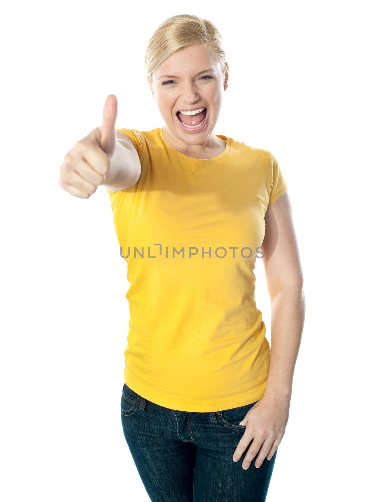 Smiling gorgeous girl showing thumbs-up by stockyimages