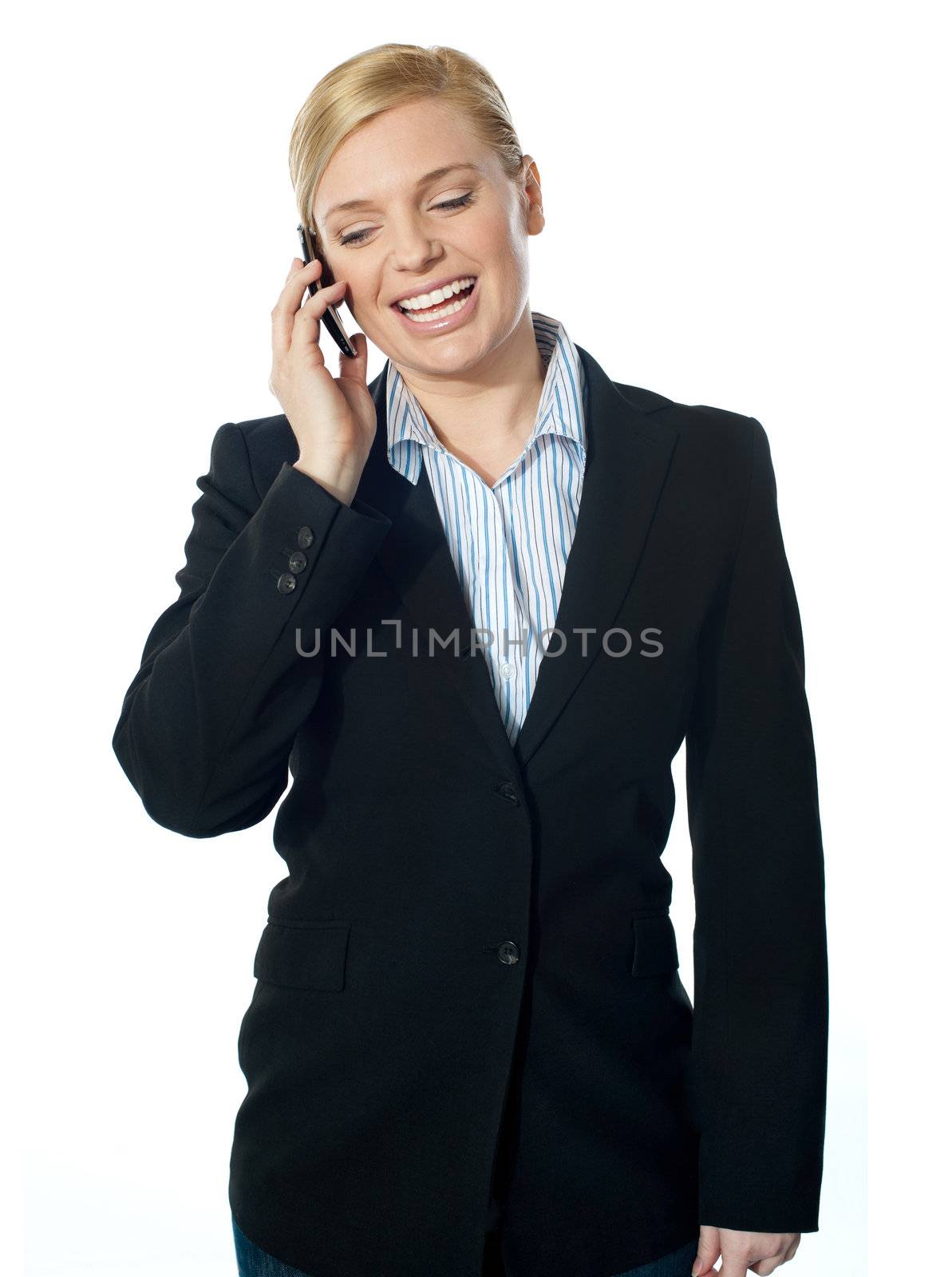 Corporate female communicating on phone by stockyimages