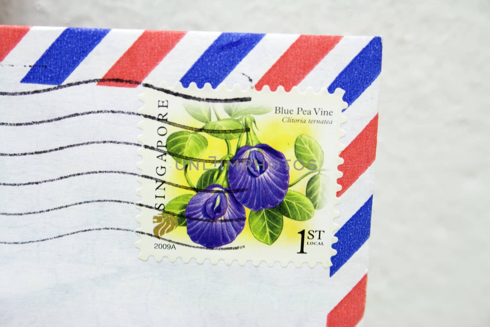 Corner of an airmail envelop with Singapore Postage.