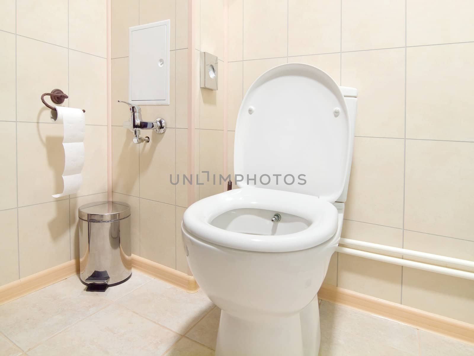 Toilet room interior with white water-closet