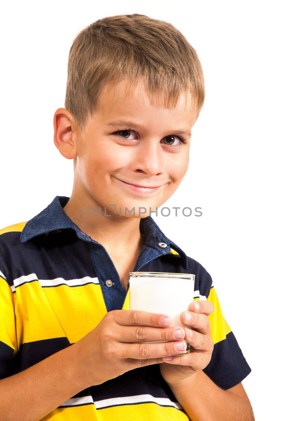 Сute boy is drinking milk. Schoolboy is holding a cup of milk isolated on a white background