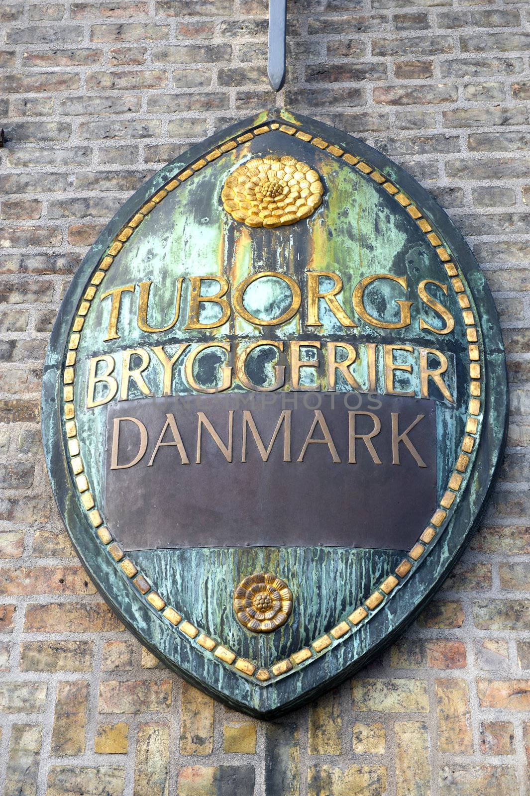Sign on a facade of the main office of brewery Tuborg in Copenhagen Denmark
