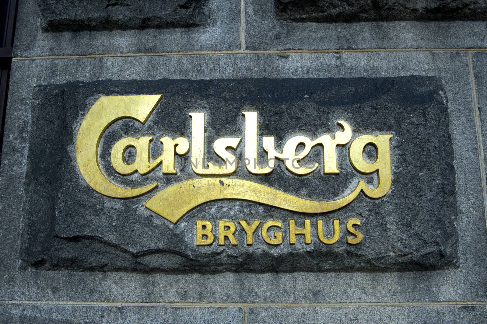 Sign on a facade of the main office of brewery Carlsberg in Copenhagen Denmark