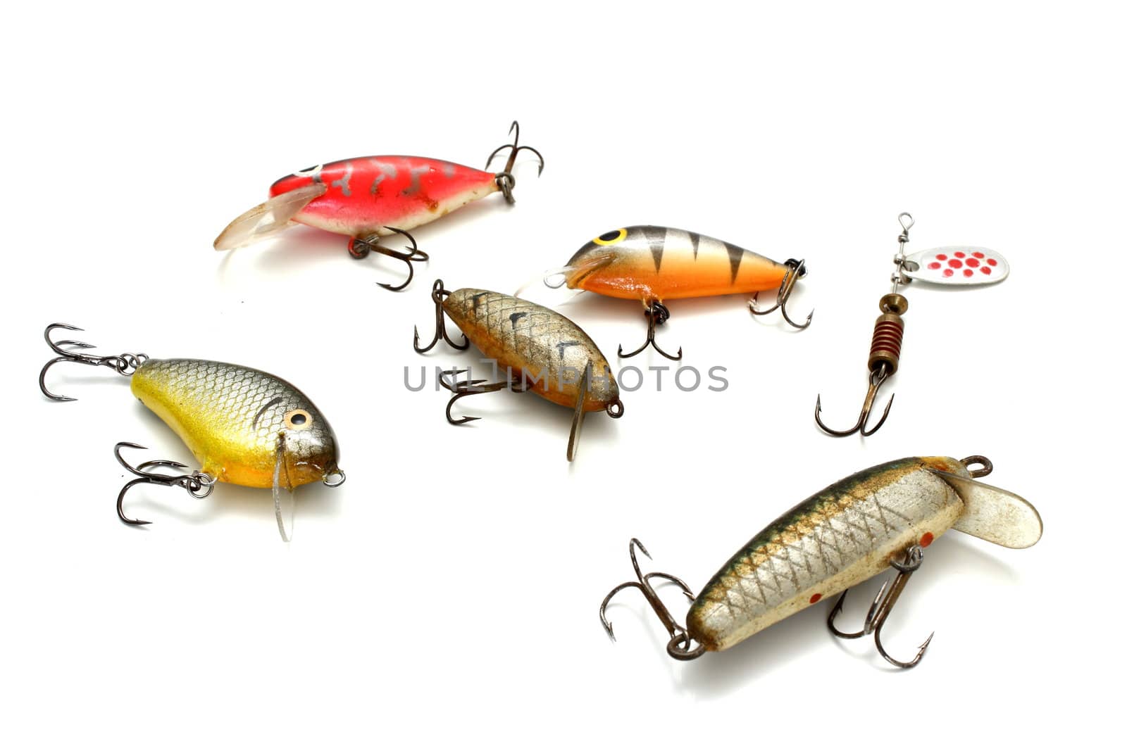 collection of small fishing lures over white background