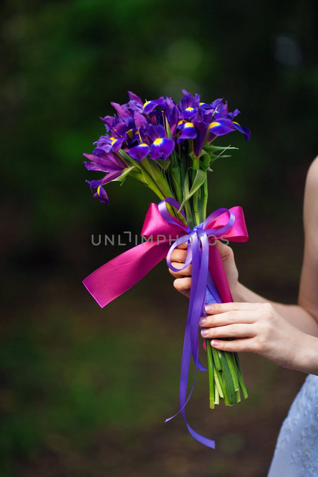 wedding bouquet in the hand of the bride