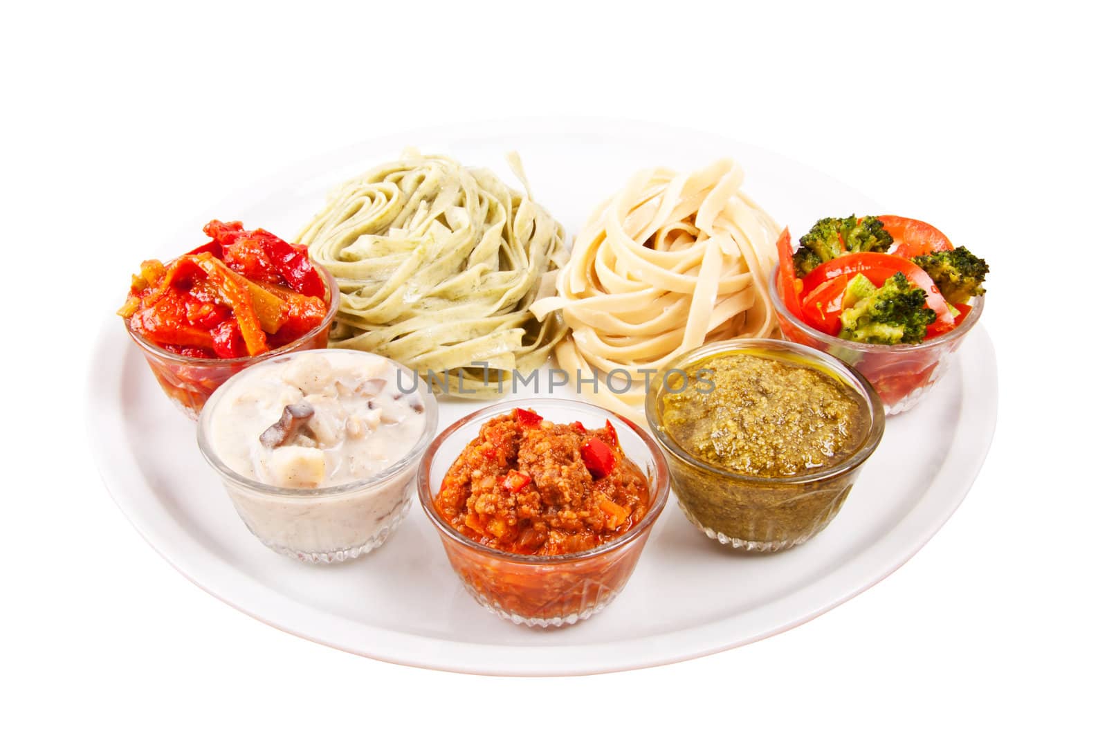 two choices of pasta and various spices on plate