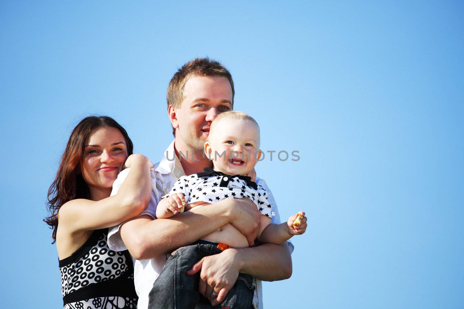happy family blue sky on background
