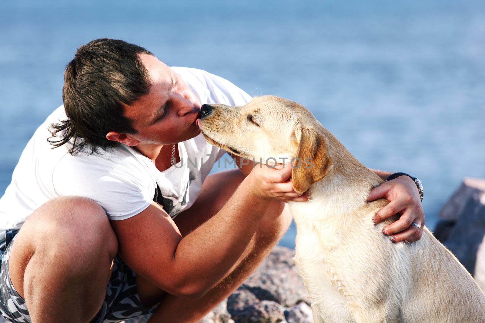 man and dog blue sky on background