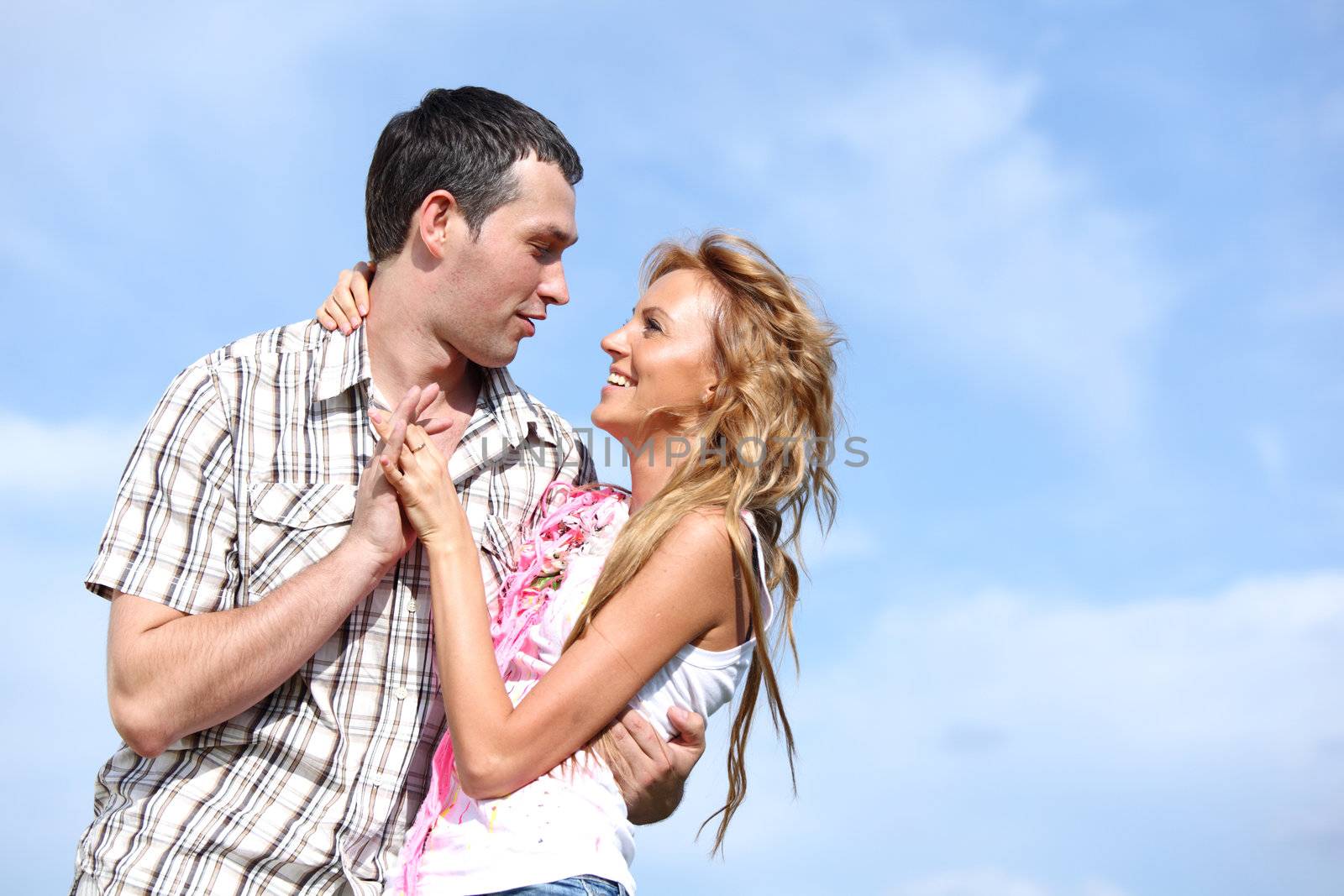 man and woman dance in the sky