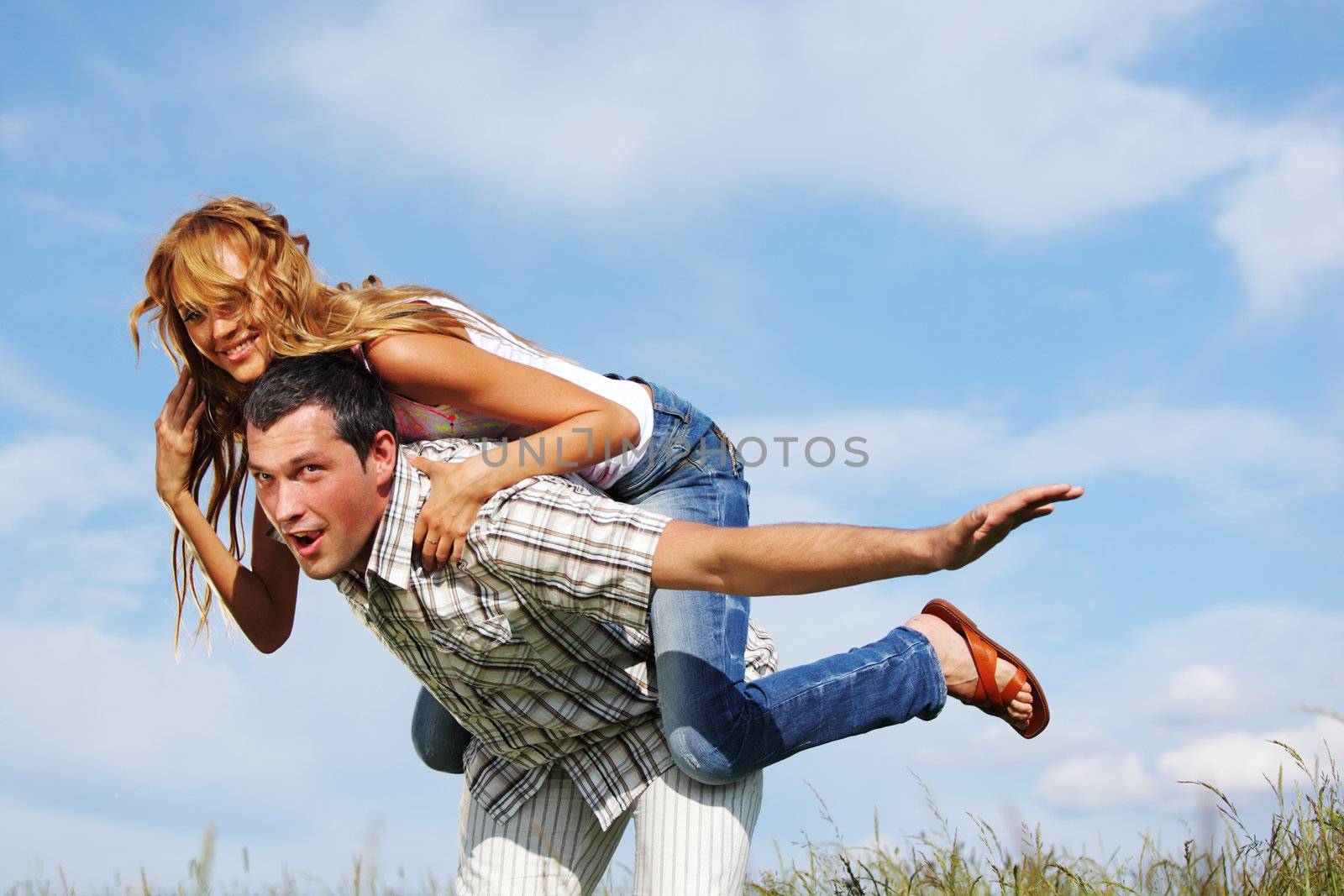 man and woman hug in the sky