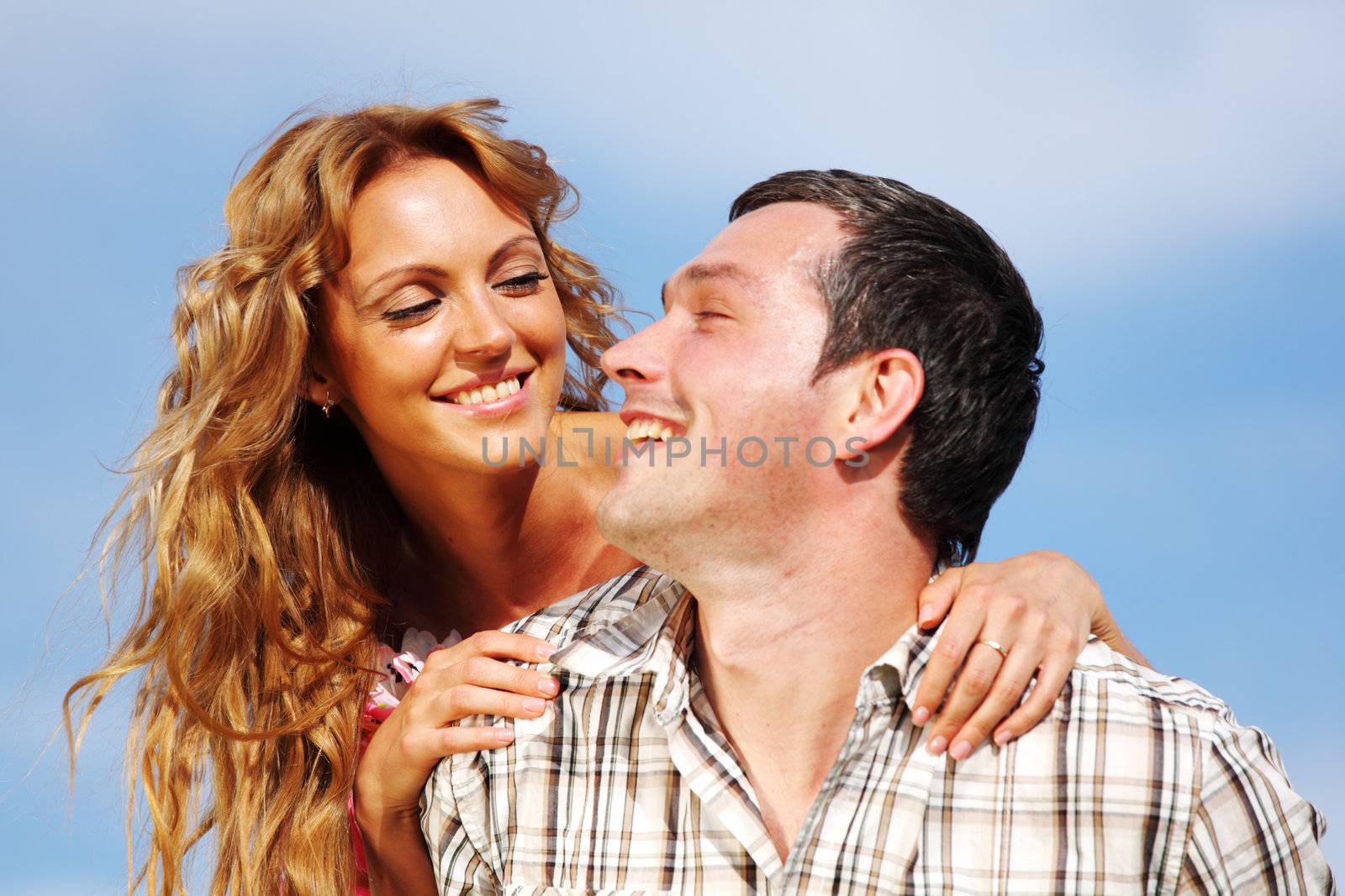 man and woman hug in the sky