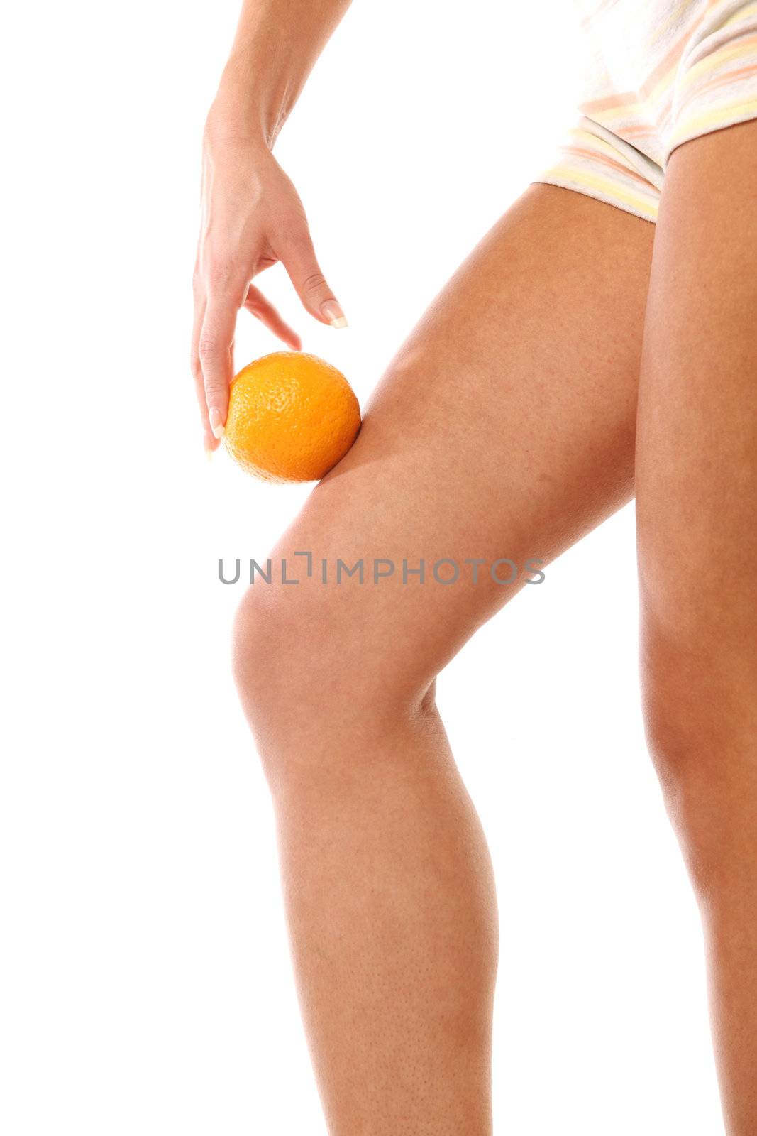 leg and oranges isolated white background 