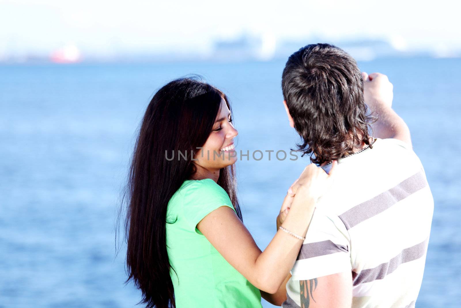 man and woman hug in the sky sea on background
