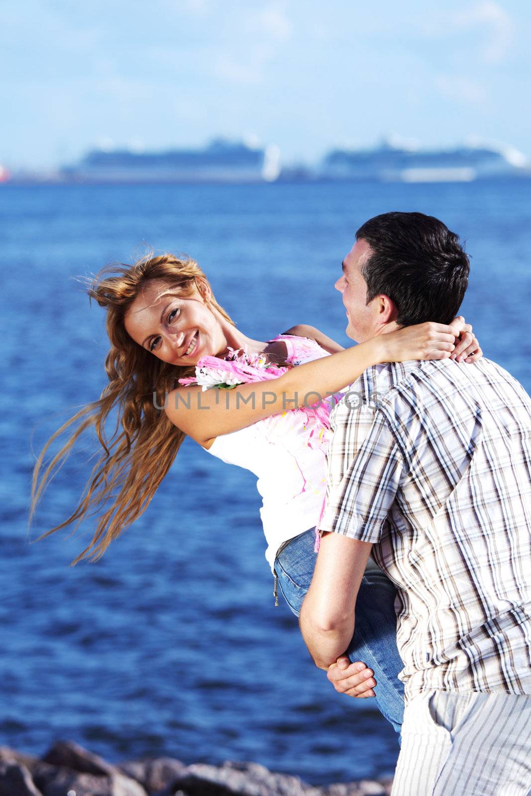 man and woman hug in the sky and sea on sea