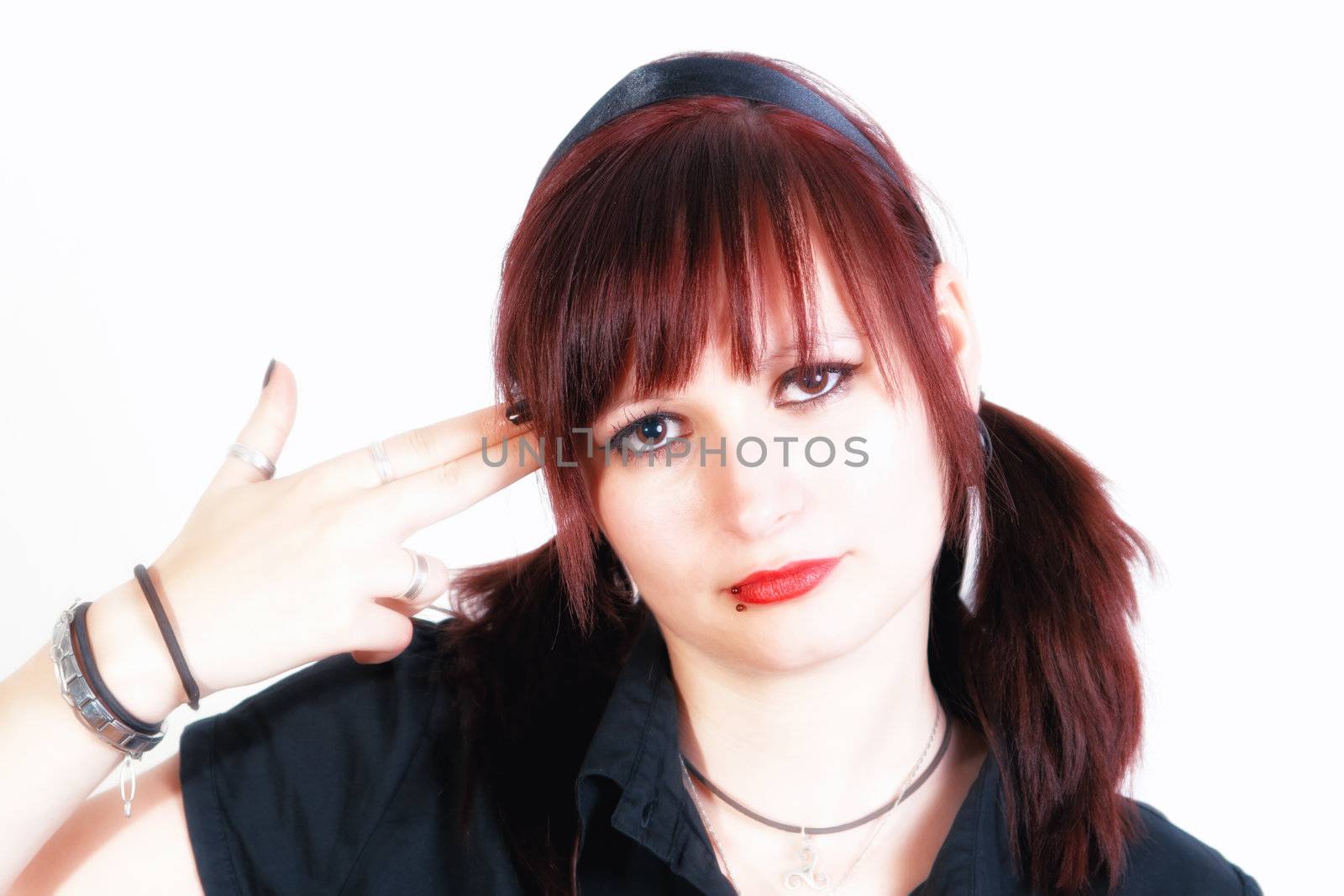 Suicide concept - young woman killing himself metaphorically - isolated on white background