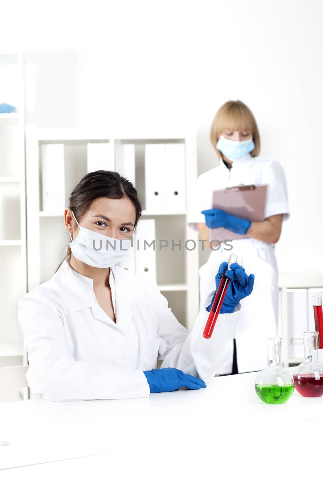 group of scientists working in laboratories with equipment