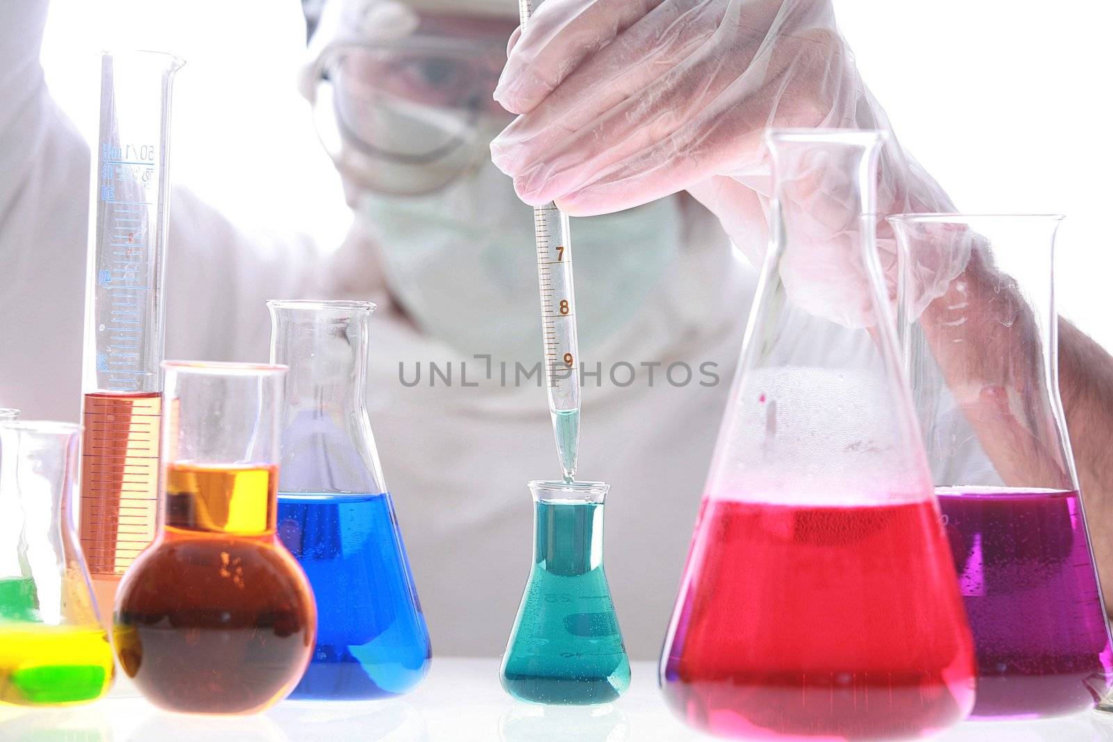 Scientist taking a probe in a labor scene with testtubes and beaker