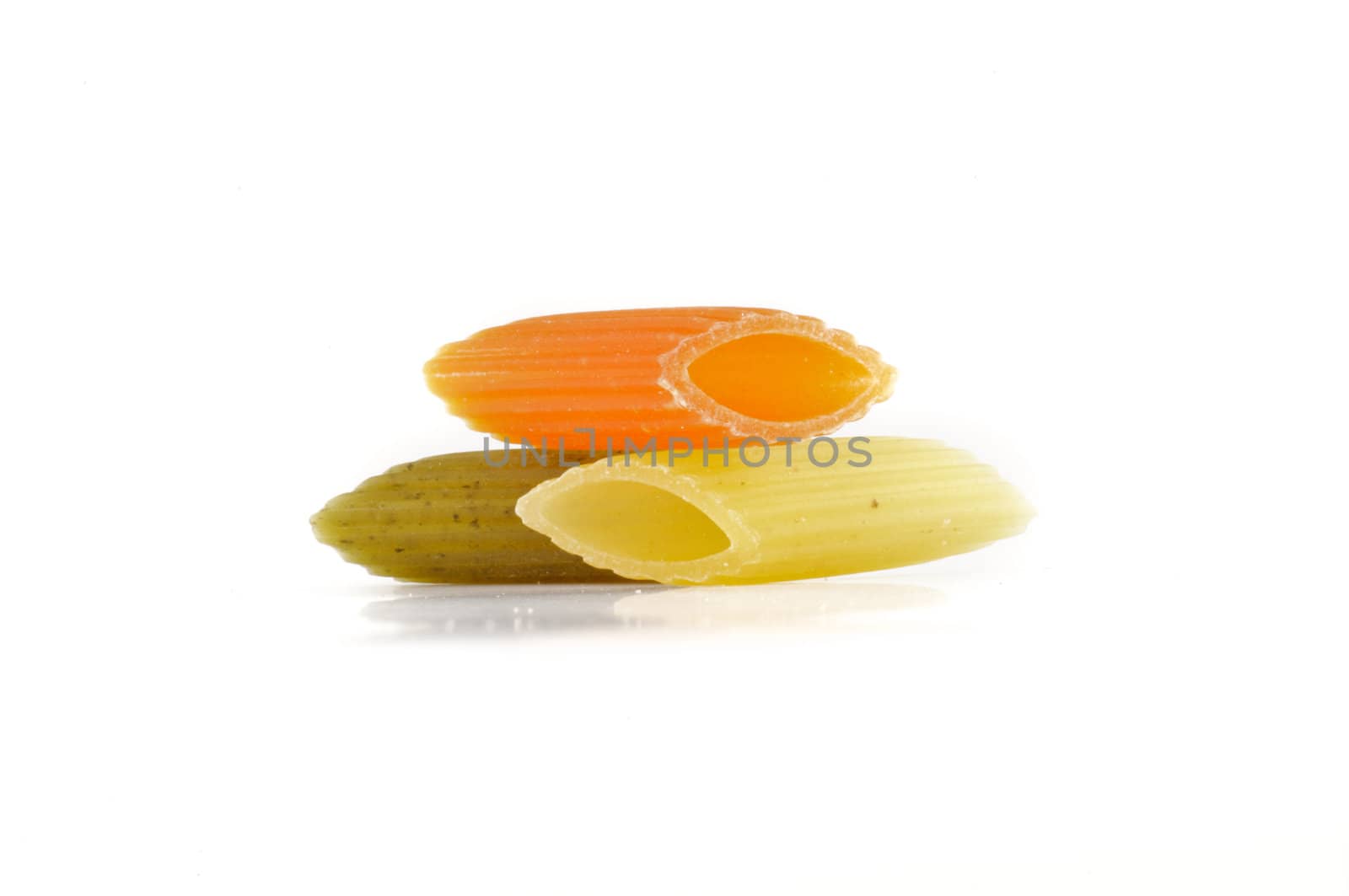 Italian pasta Penne rigate tricolore isolated on white background