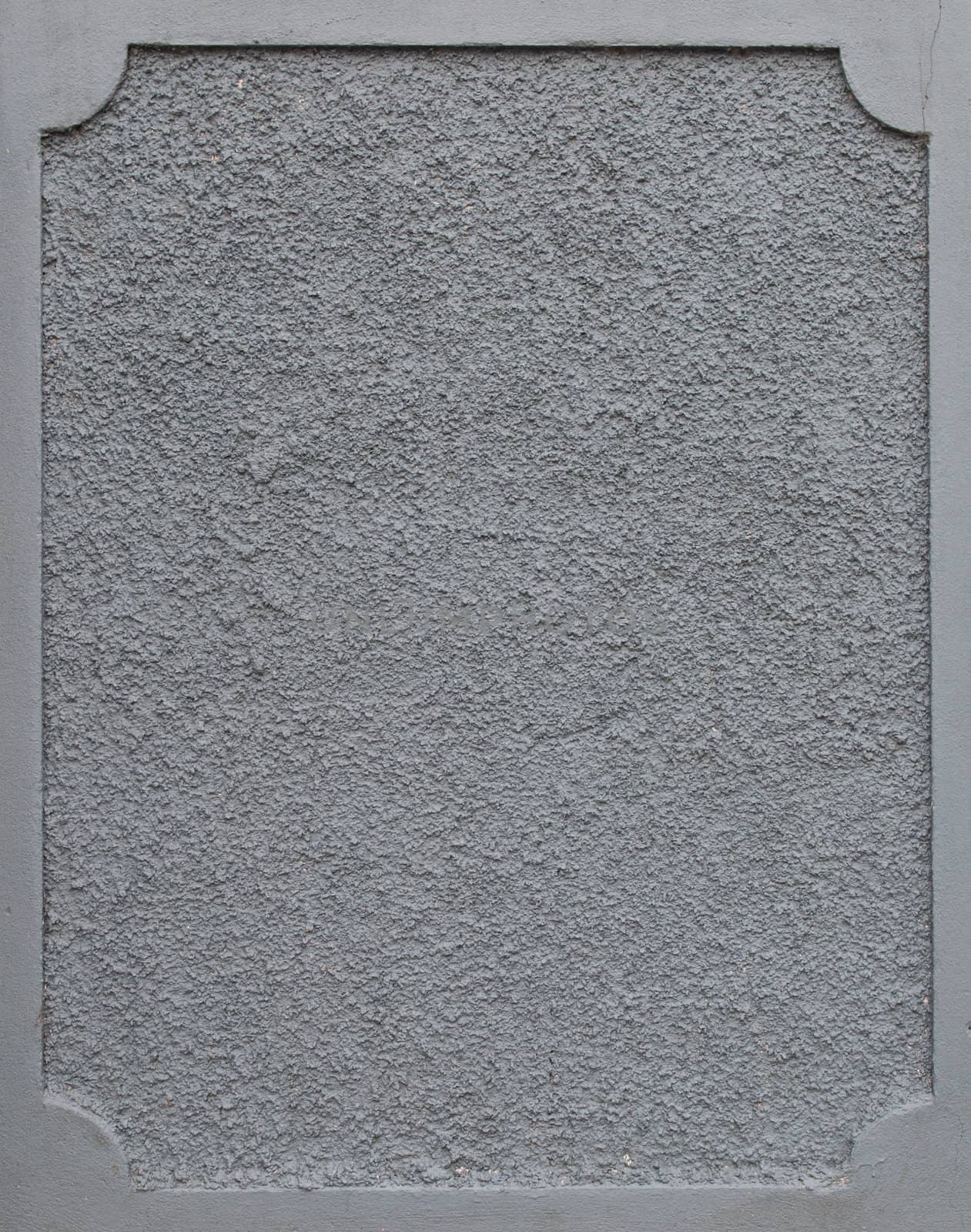 frame on a grey plaster wall (copy-space available for design)