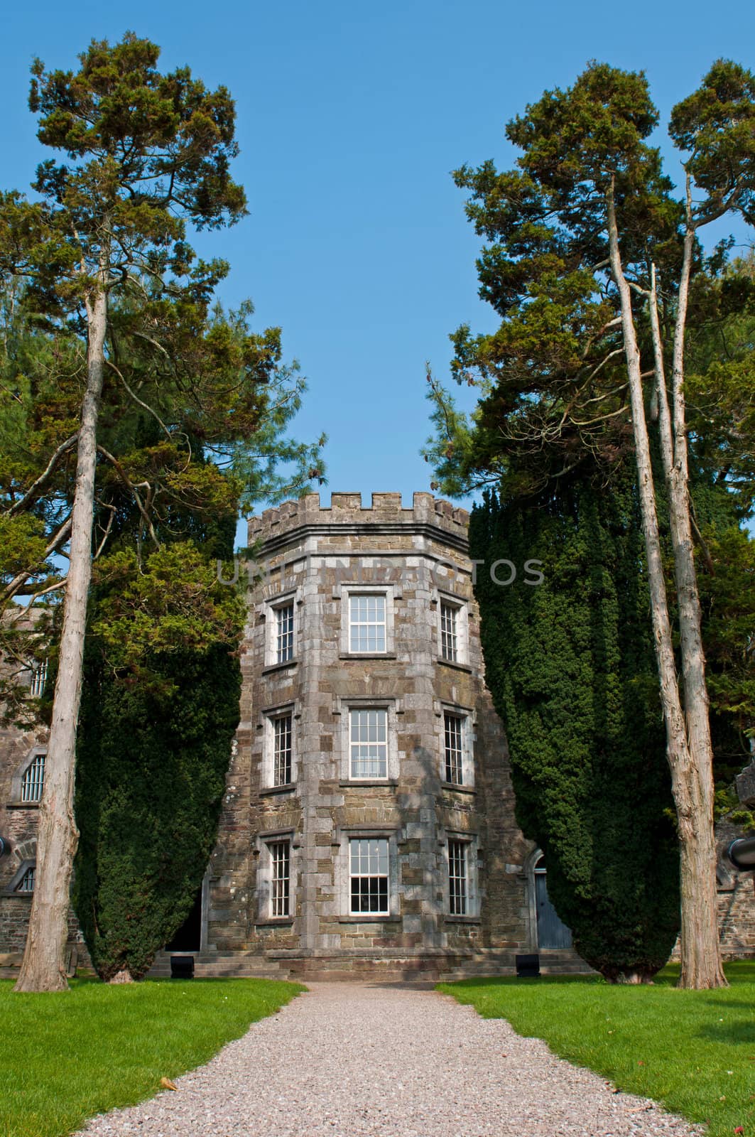 historical Cork City Gaol prison in Cork, Ireland (stunning garden trees and blue sky)
