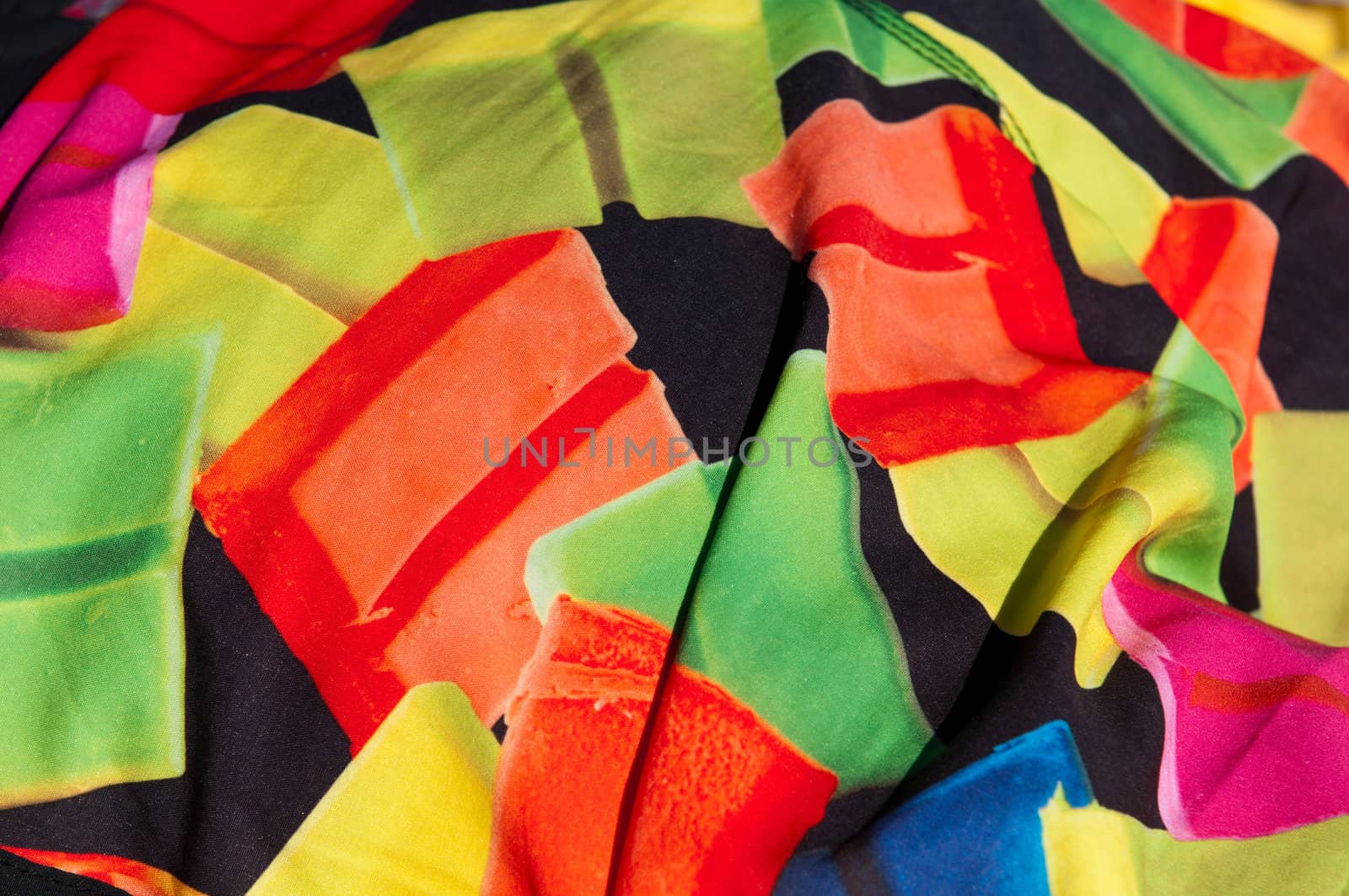 unshaped and colorful fabric background or texture (focus on the center)