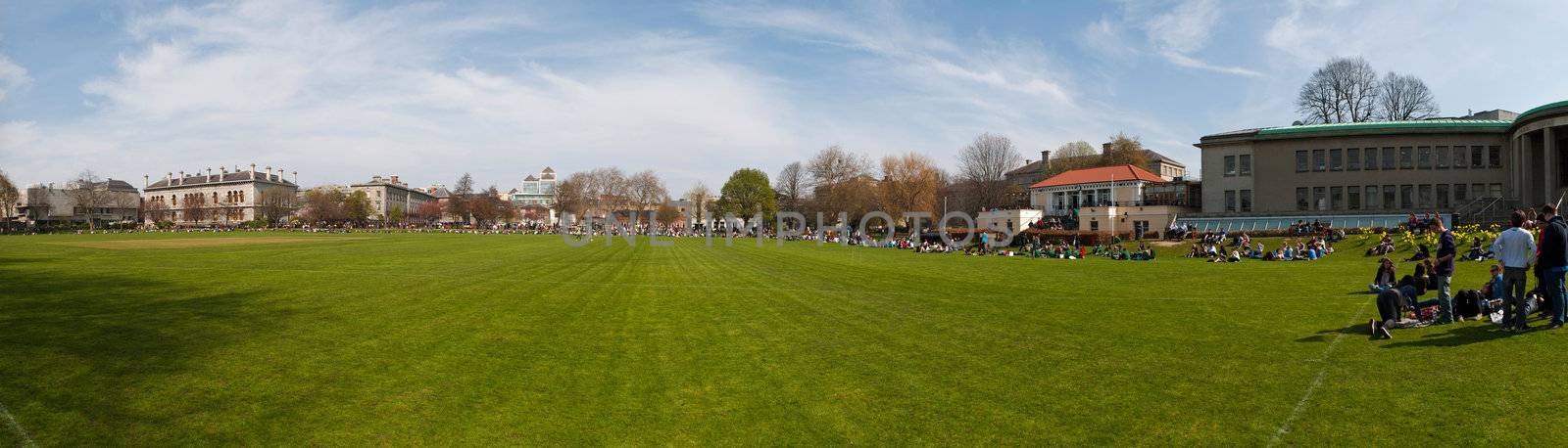 DUBLIN, IRELAND - MARCH 29: students enjoying outdoors at the cricket field in the Trinity College on March 29, 2012 in Dublin, Ireland.Ranked in 2011 by The Times as the 117th world's best university