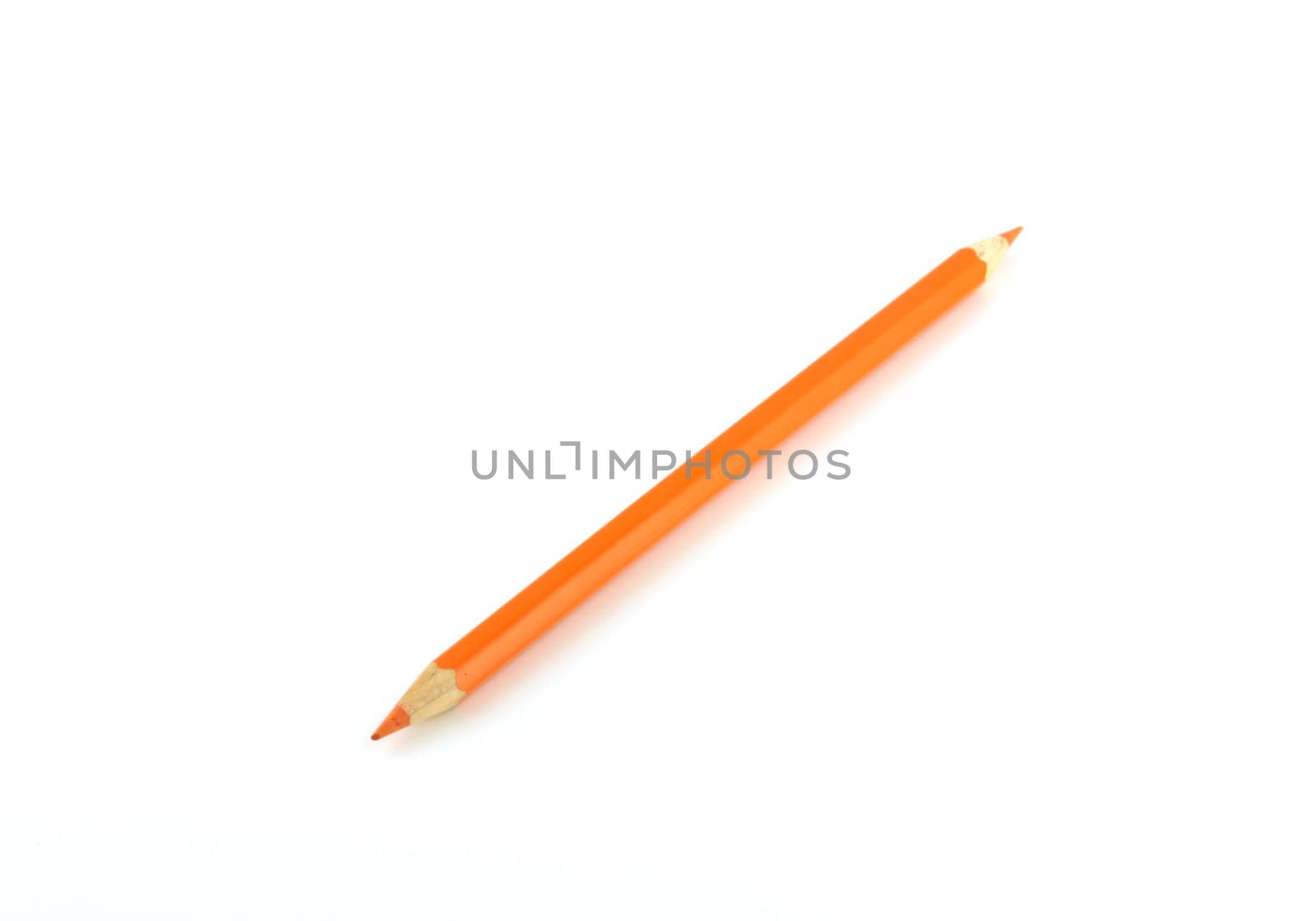 Orange pencil over white