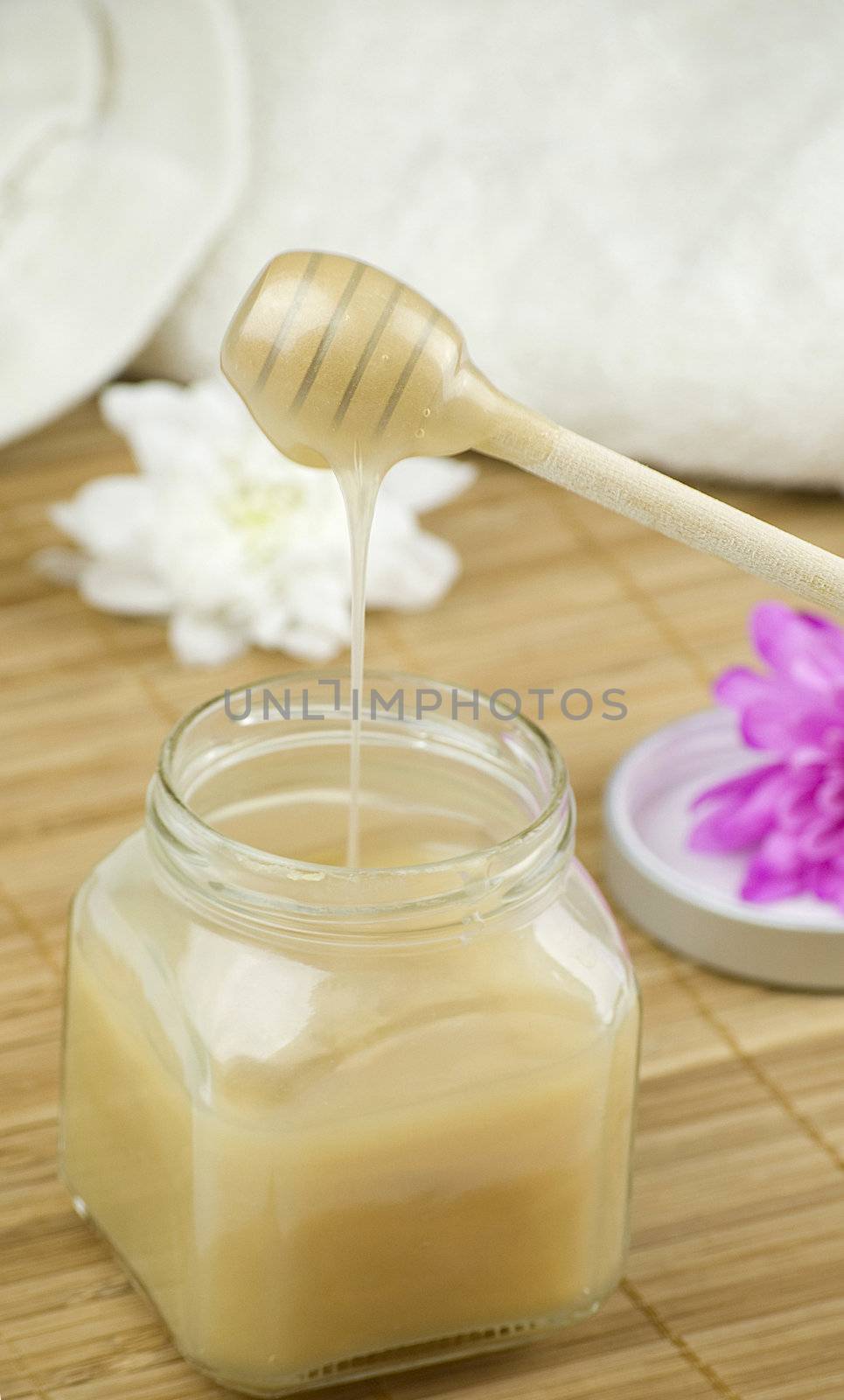 relaxing aroma of almond coconut vanilla milk and honey bath foam over wooden mat