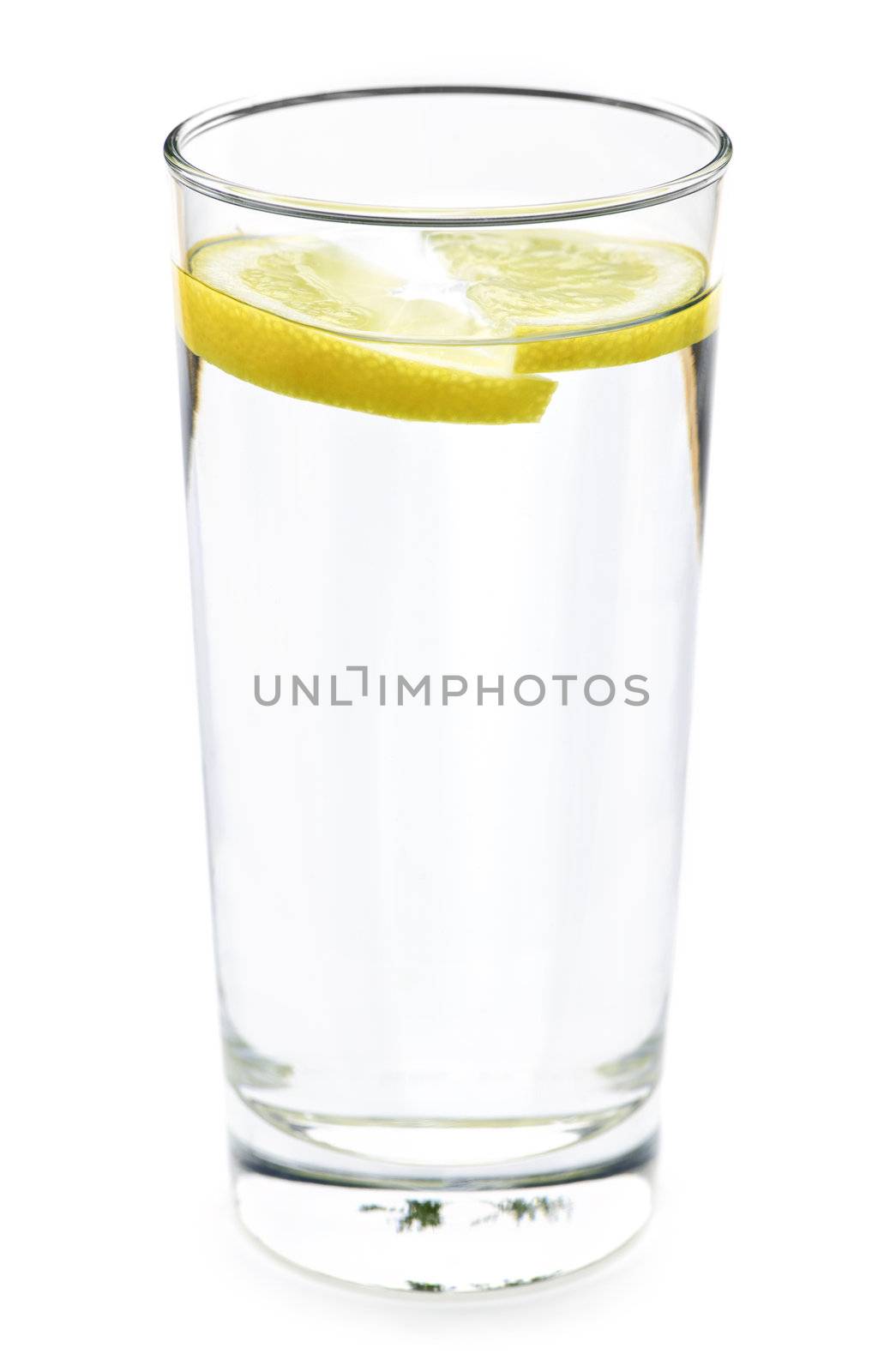 Full glass of water with lemon isolated on white background