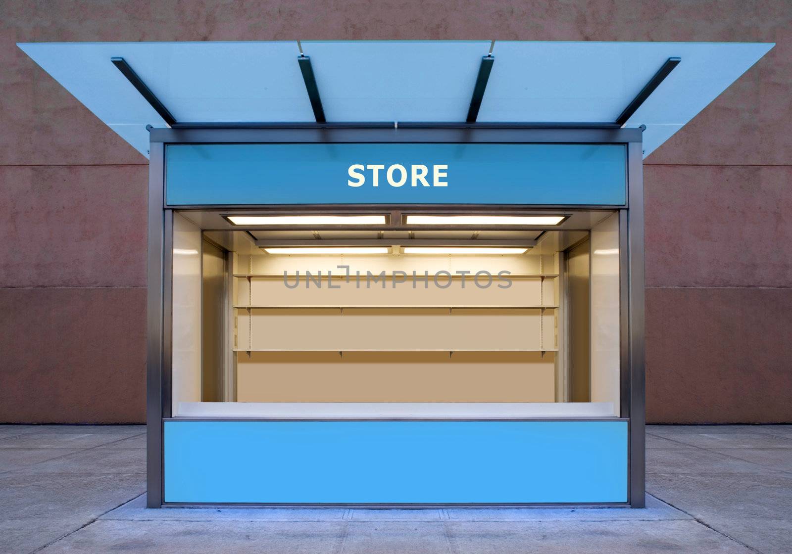 empty news stall on street of city at night time