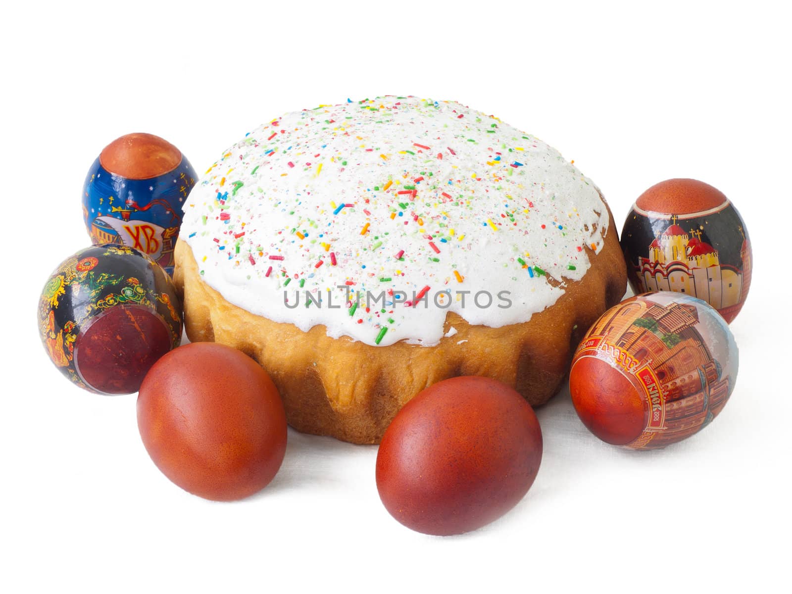 Easter eggs around the isolated Easter cake