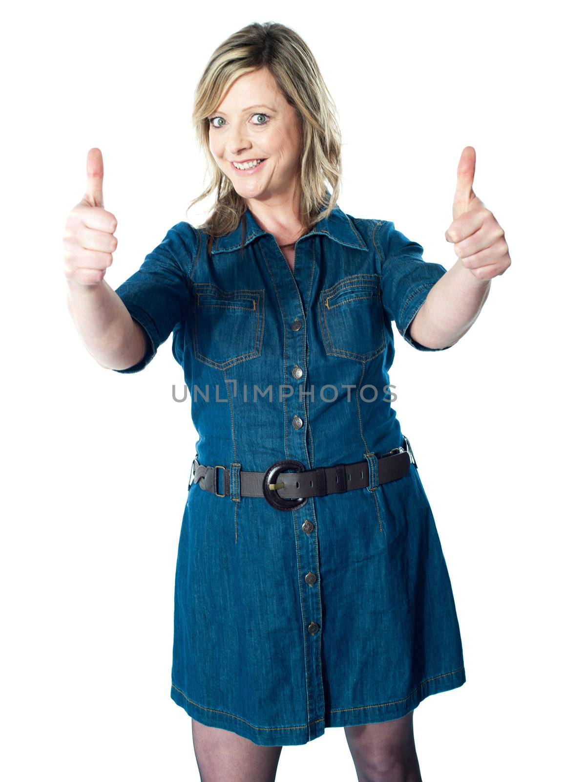 Gorgeous lady showing double thumbs-up dressed in blue attire