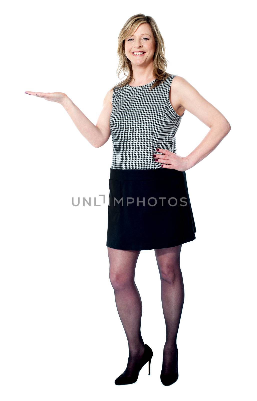 Beautiful woman presenting copy space by stockyimages