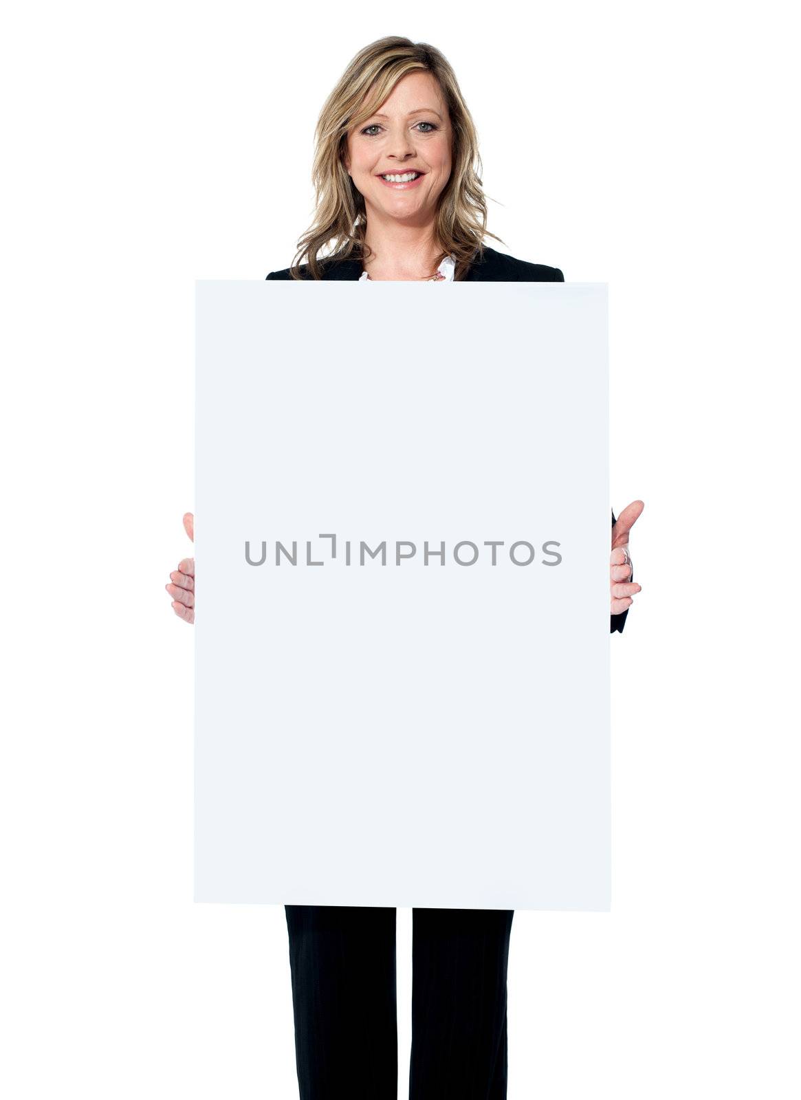 Business woman showing blank signboard by stockyimages