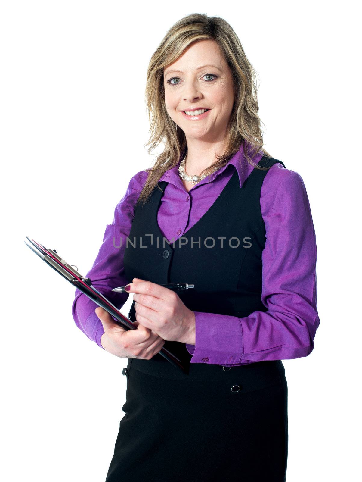 Portrait of experienced lady writing on clipboard, smiling at camera