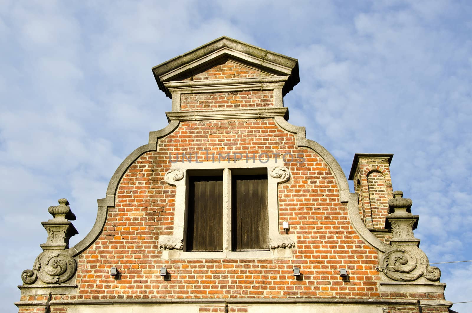 background of ancient grunge vintage architectural building on cloudy sky.