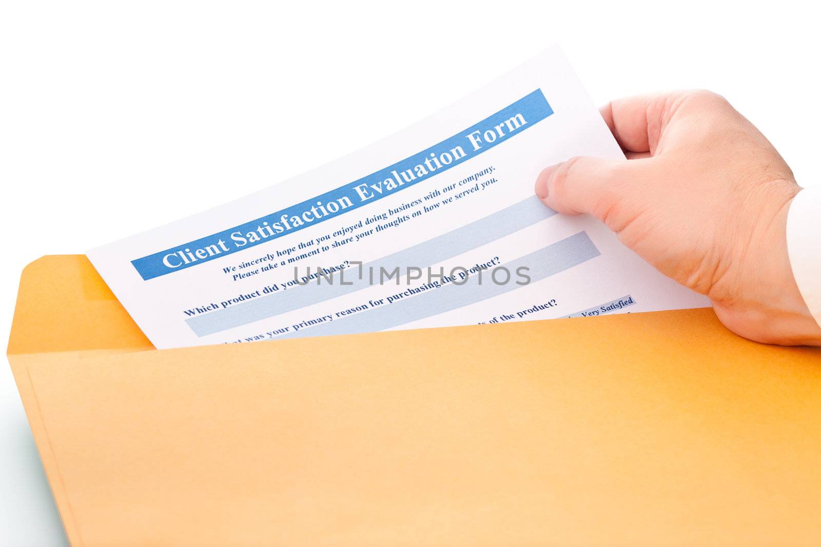 hand takes the paper from the envelope