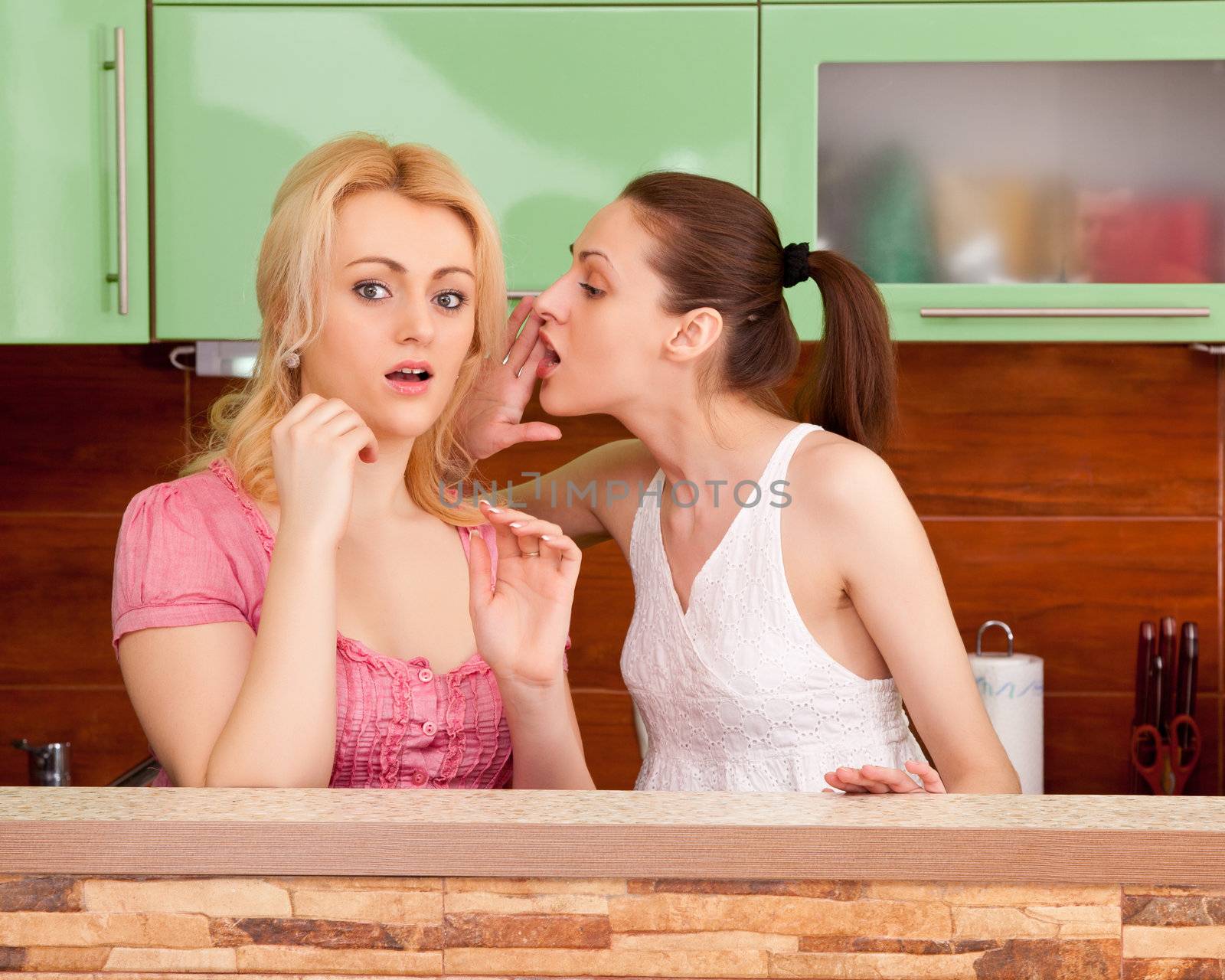 two girls gossiping in the kitchen interior