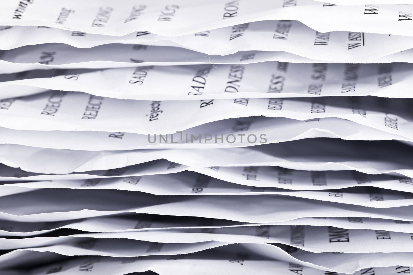 pile of crumpled papers closeup on white background