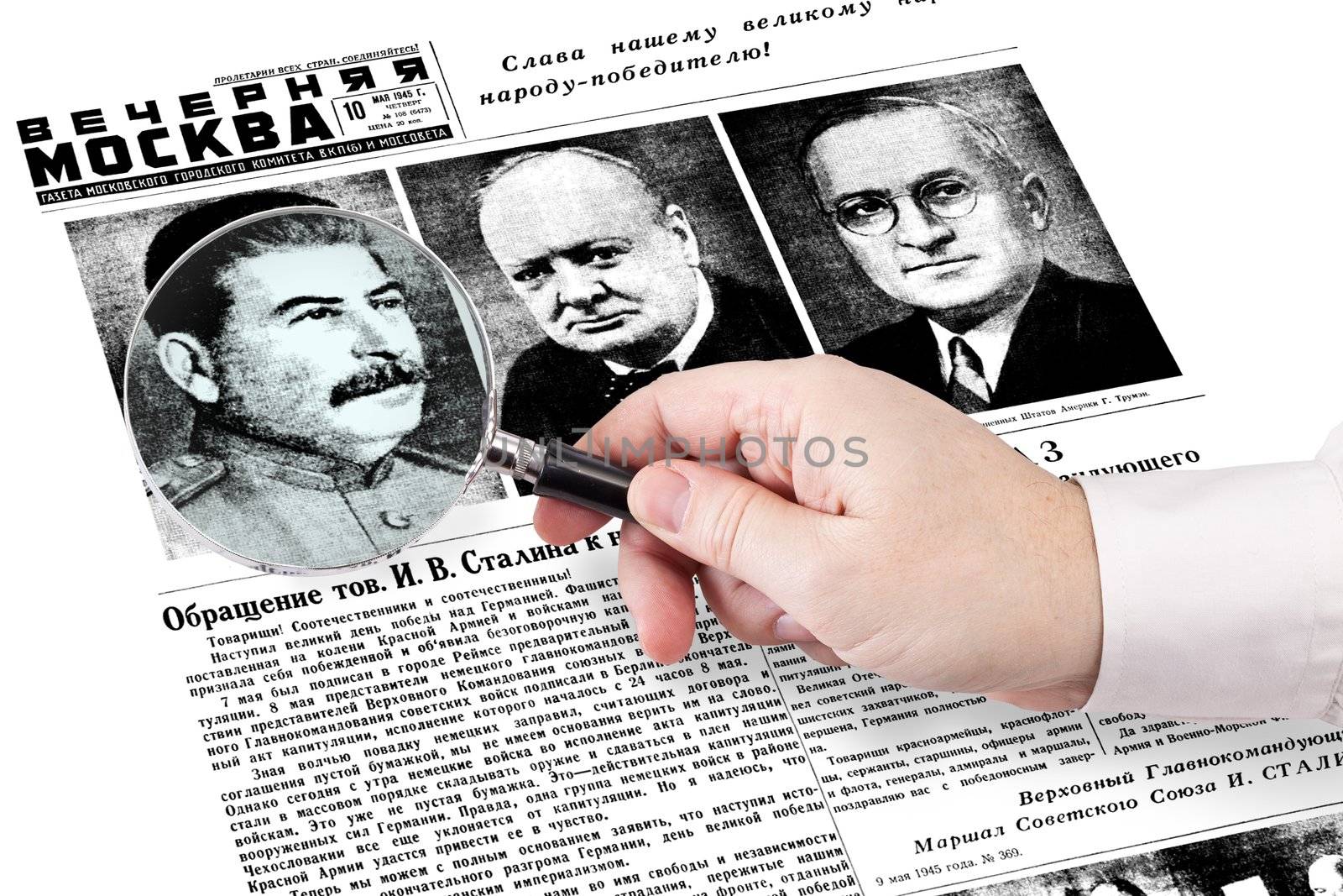 hand with magnifying glass stuck on the newspaper "Evening Moscow", released May 10, 1945.