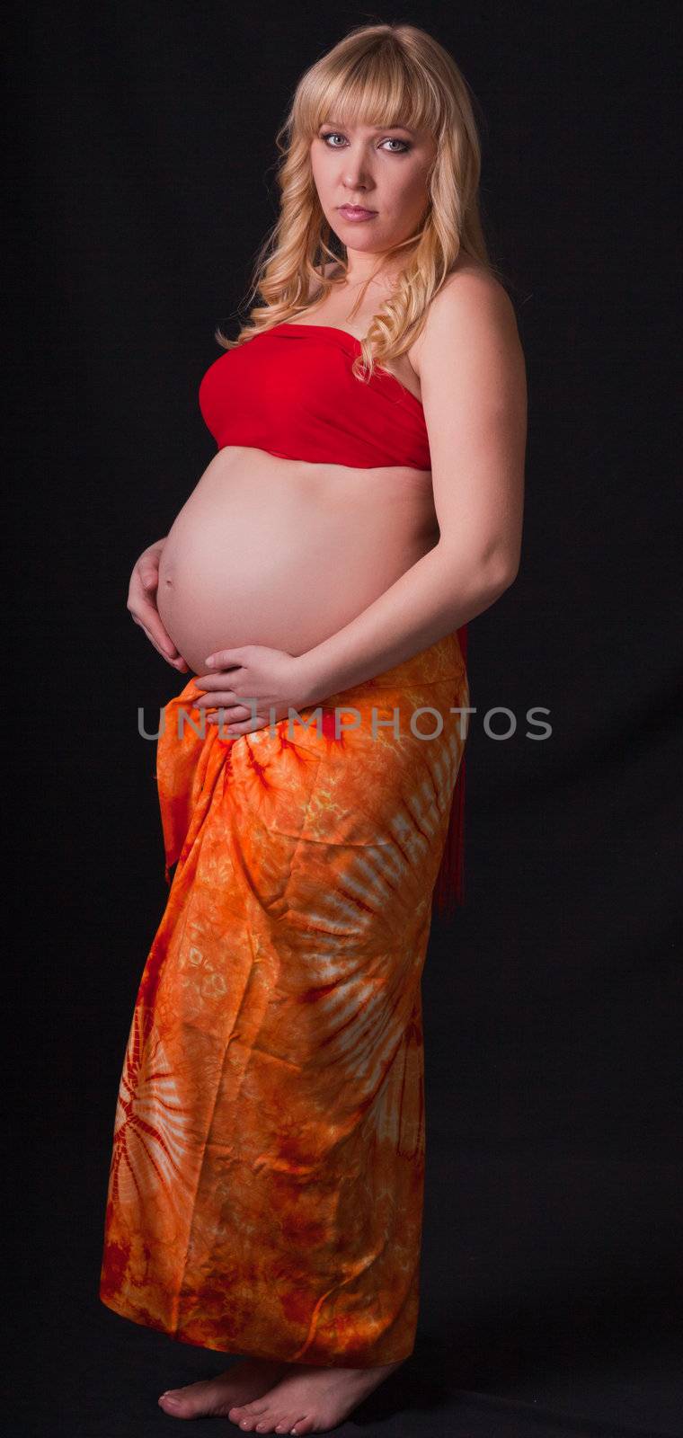 art portrait of pregnant woman on a black background by Sergieiev