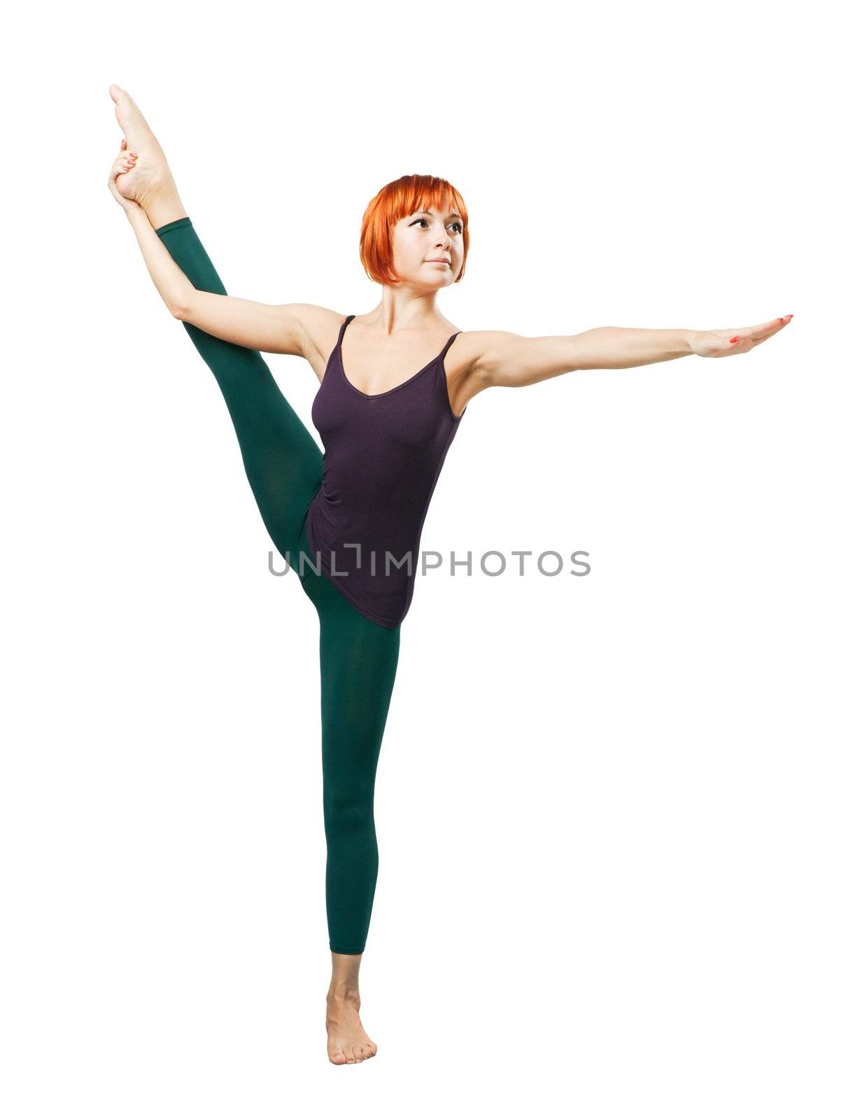 Slim beautiful woman practicing yoga asana standing on one foot