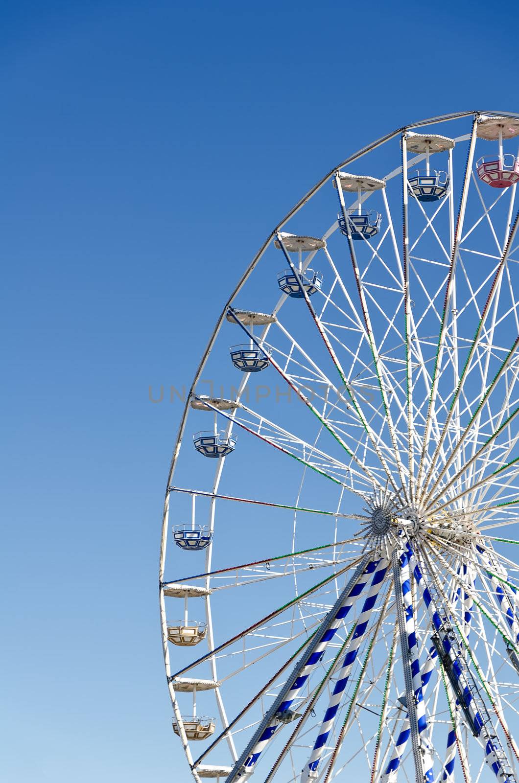 Ferris wheel against the blue sky