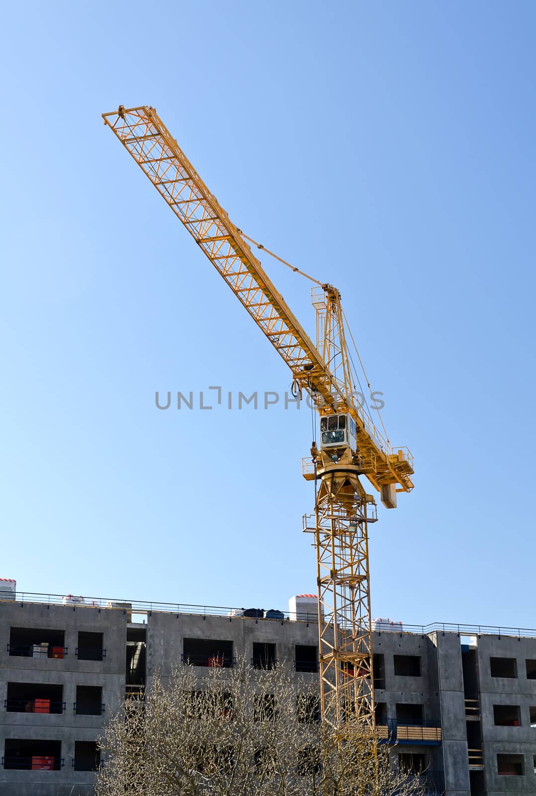 Tower crane near building under construction