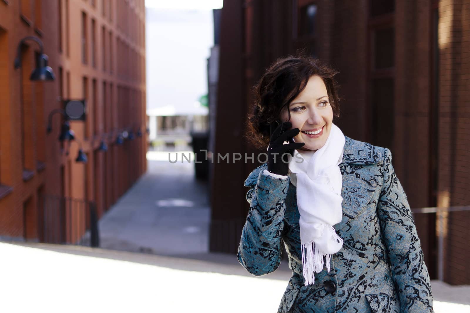 Portrait of smiling girl with a mobile phone 