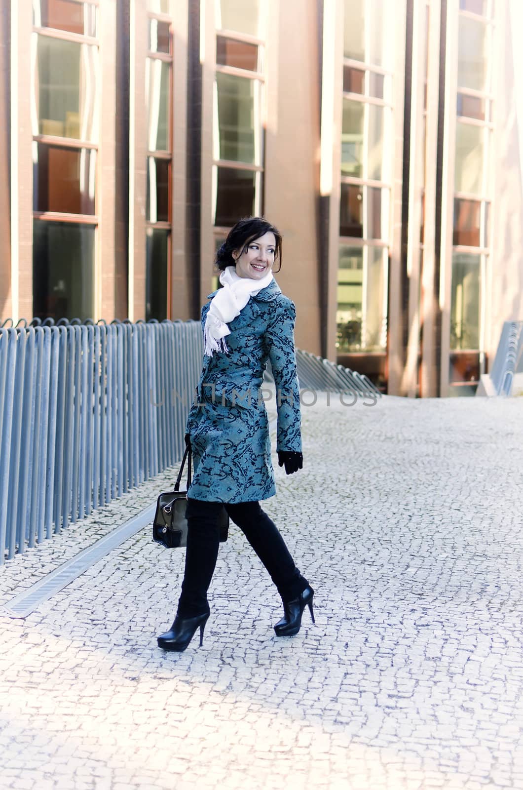 Girl walking around town with a bag
