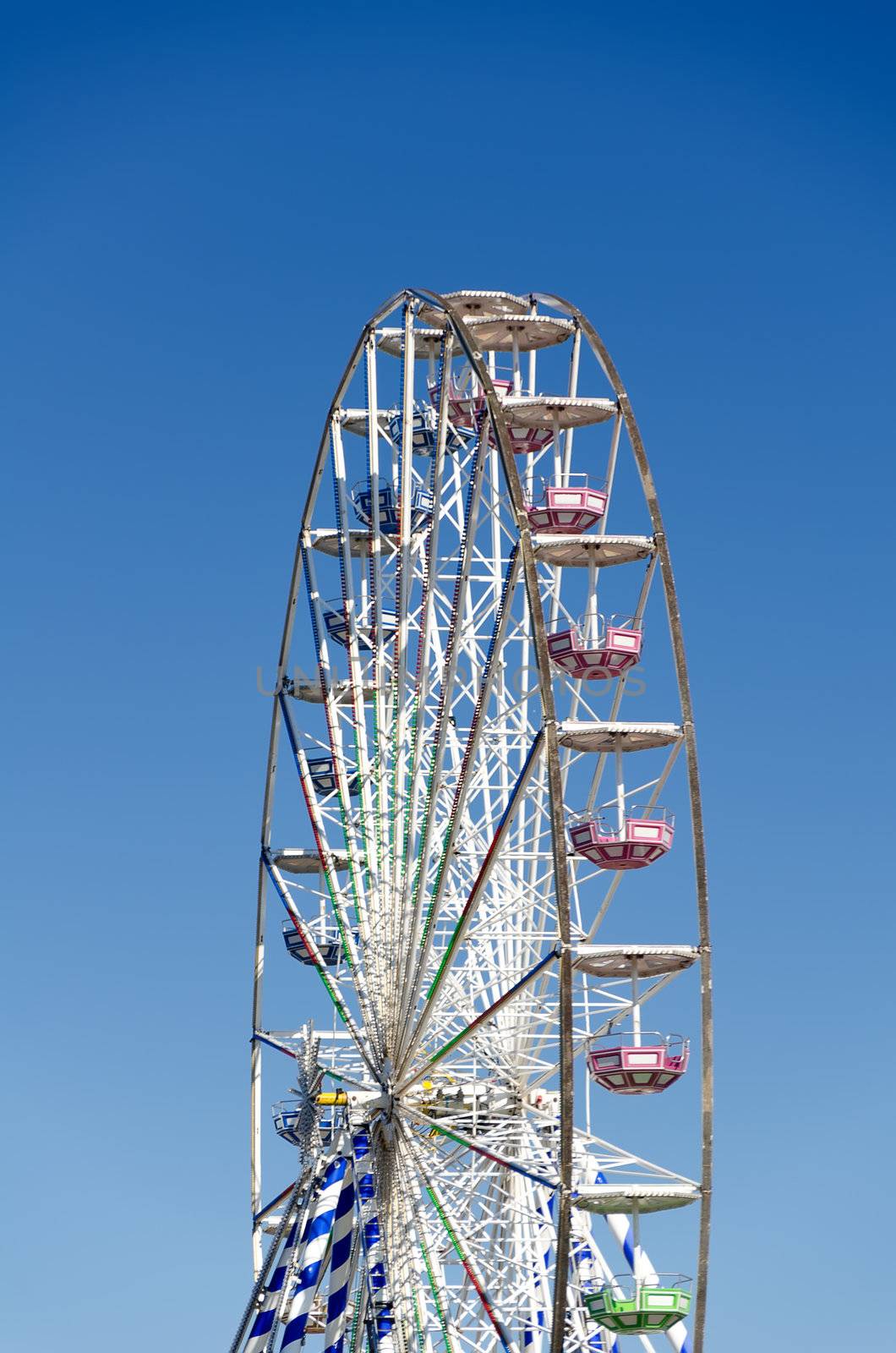 Ferris wheel against the blue sky